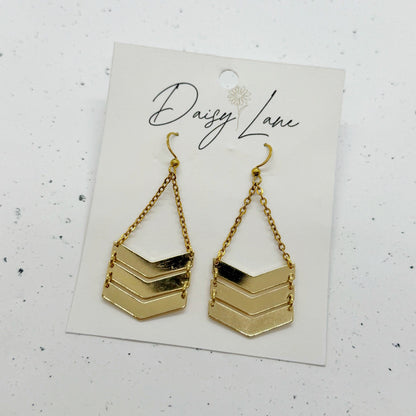 Gold chevron earrings on a 'Daisy Lane' branded card against a white background